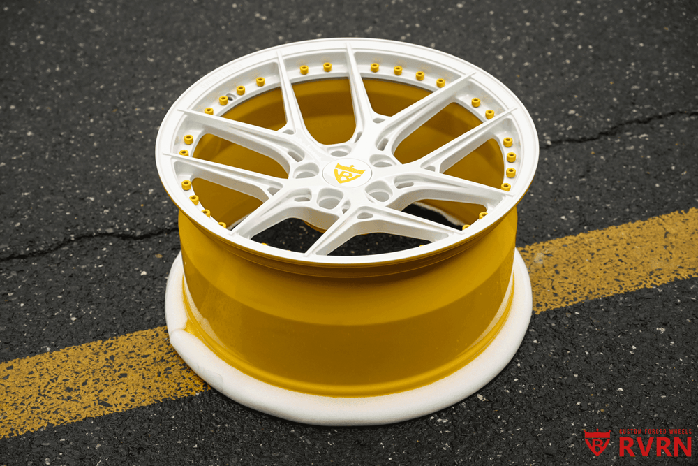 Custom yellow and white wheel design for 2019 Ford Mustang, showcasing unique style for car enthusiasts.