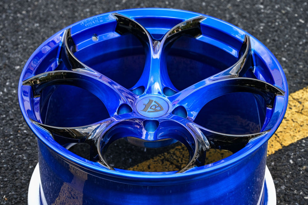 Custom forged blue Corvette C7 wheel with sleek design and intricate detailing, perfect for enhancing any Corvette's style.