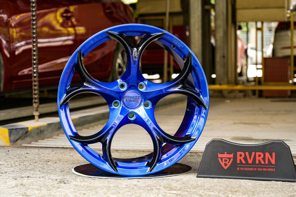 Sleek forged blue Corvette C7 wheel on display, showcasing custom rim design for enhanced car aesthetics.