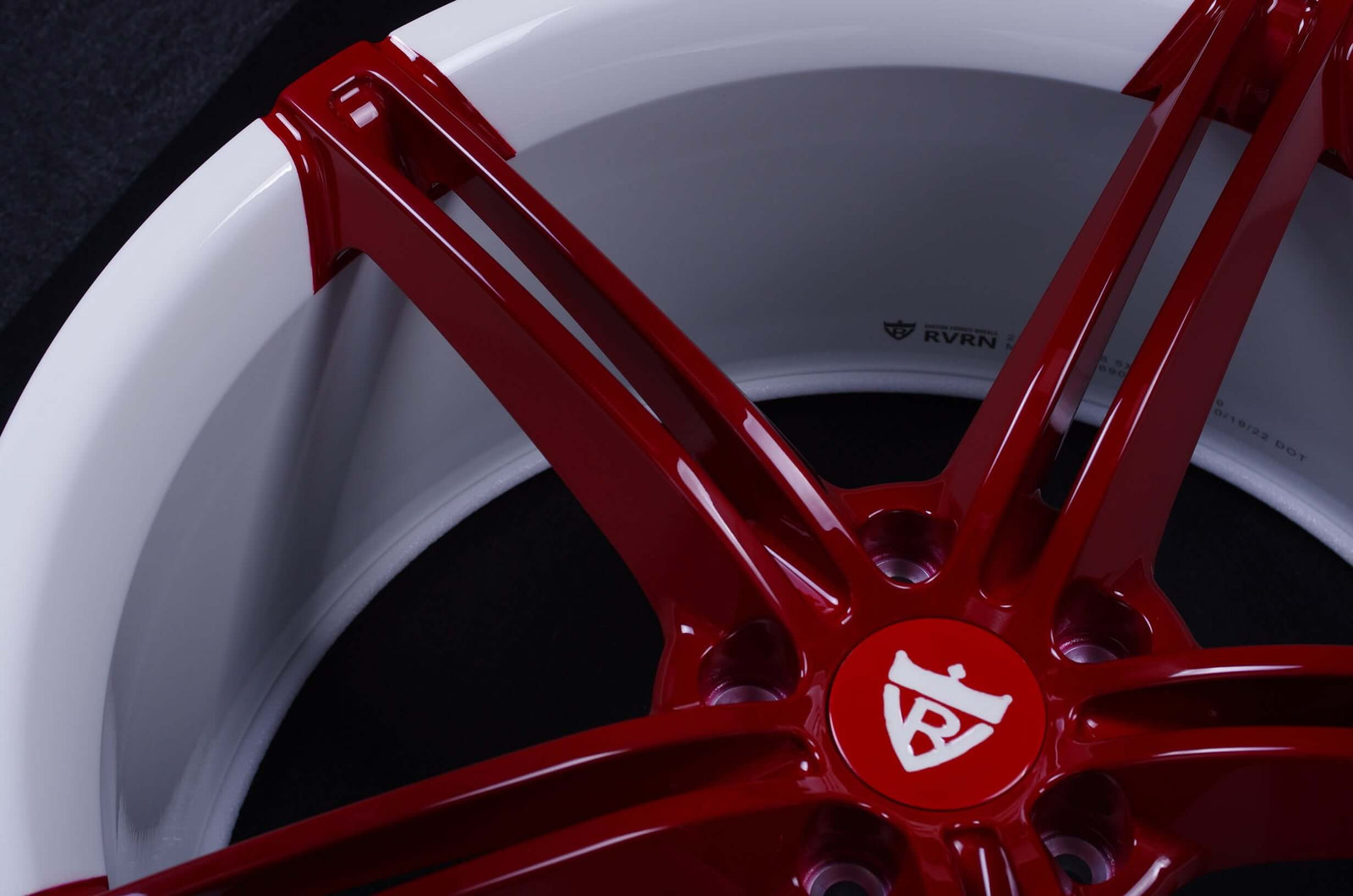 Close-up of maroon custom forged Camaro 5 spoke wheels showcasing intricate design and glossy finish.