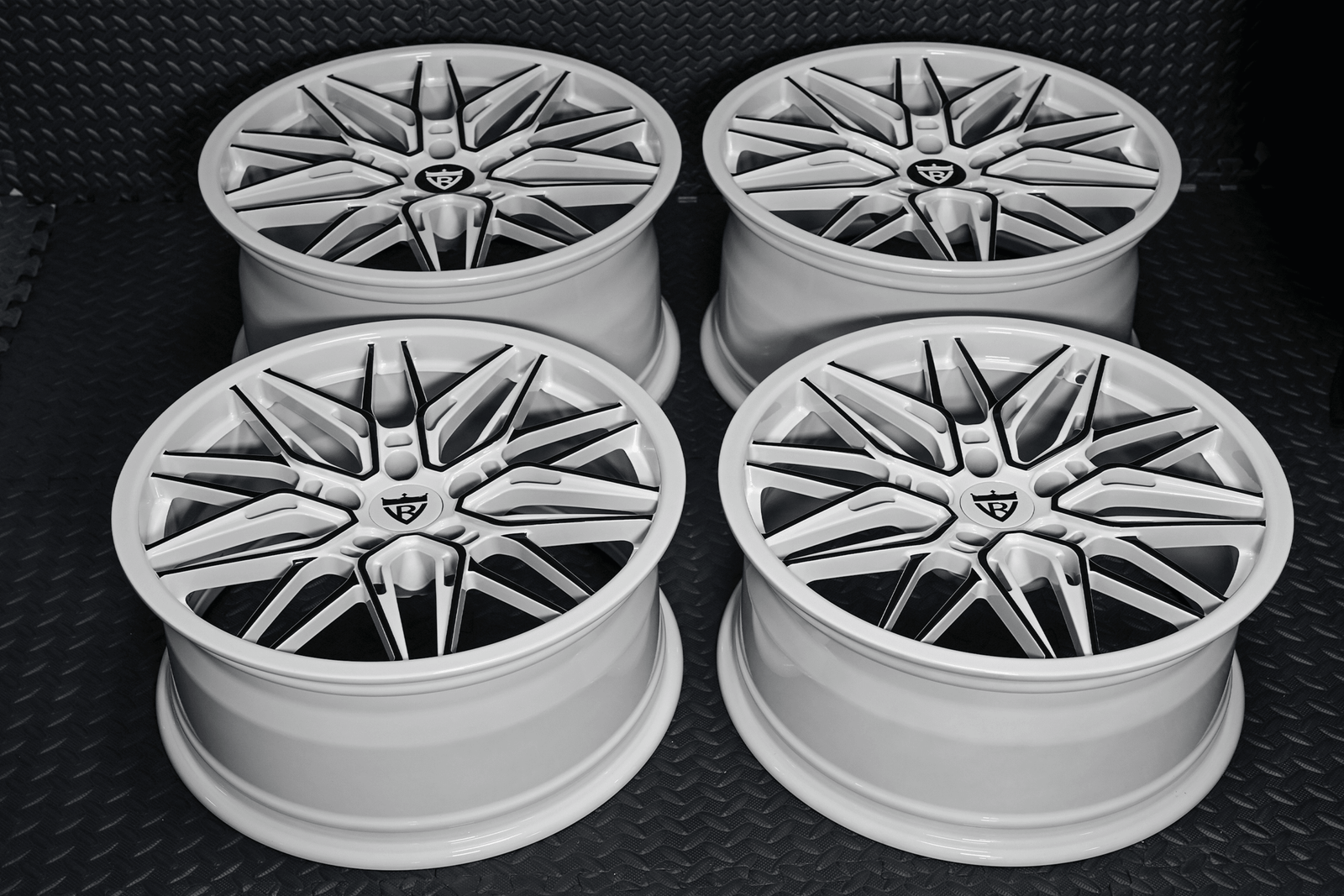 Custom forged Corvette C7 wheels featuring stylish white and black rims, showcasing quality design and craftsmanship.