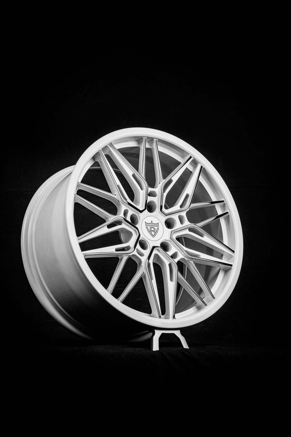 Corvette C7 custom forged wheel in white and black, showcasing sleek design and modern aesthetics.