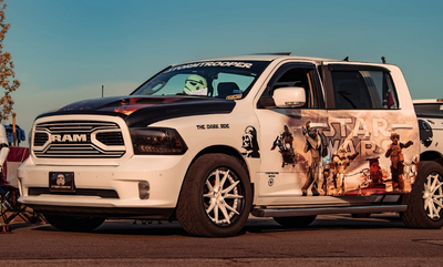 Side profile of 2018 Dodge Ram with custom 20x9 deep dish forged wheels, truck stance, tailored design