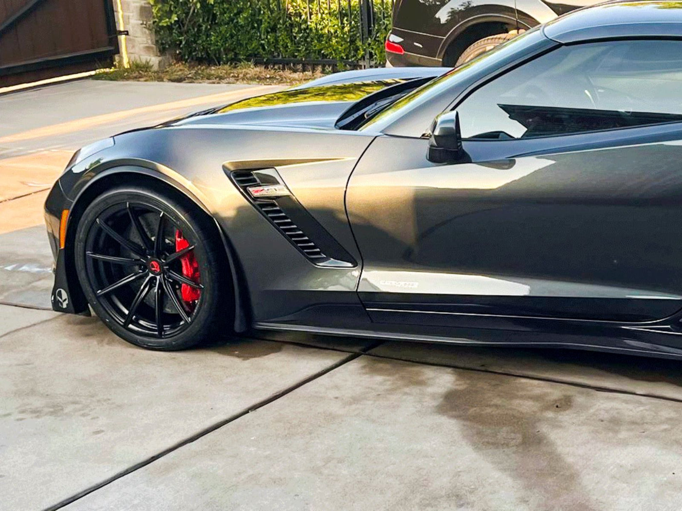 Spoke detail of concave forged wheel on C7 Corvette Z06, matte black aesthetic, custom machining