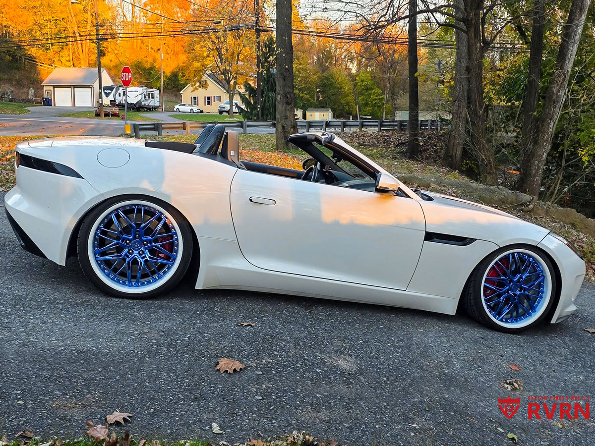 Side profile of 2015 Jaguar F-Type S Convertible showing RVRN RV-T081 2-piece forged deep dish wheels in Blue Chrome and Ivory White finish