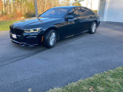 Side profile of 2020 BMW M670 with RVRN TR66 20x8.5 / 20x10 forged wheels in brushed silver and matte black.