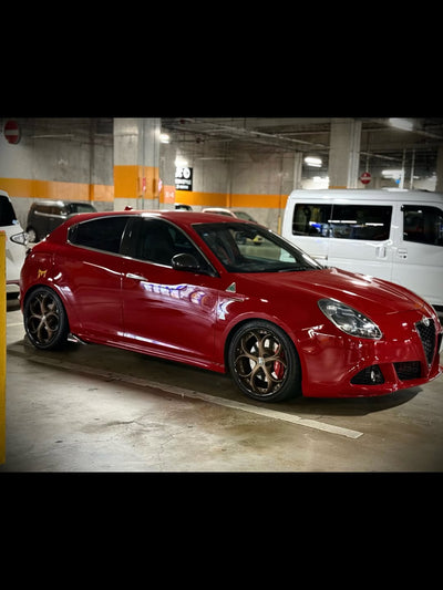 2013 Alfa Romeo in a parking garage with RVRN custom forged bronze and black rims showcasing stylish alfa romeo wheels.