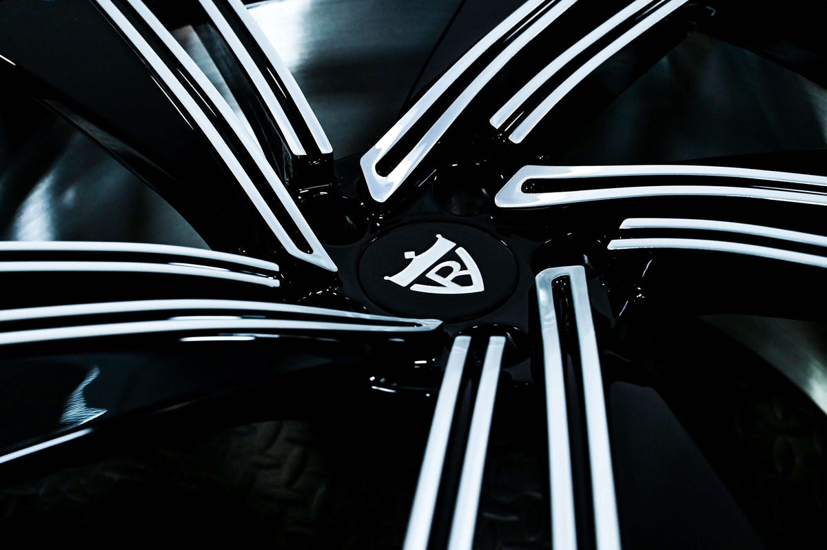 Close-up of stylish aftermarket Audi R8 wheels with sleek black and silver design, perfect for customizing your vehicle.
