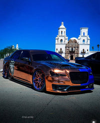 2014 Chrysler 300S with custom 22-inch forged wheels parked in front of a historic building, showcasing stylish custom rims.
