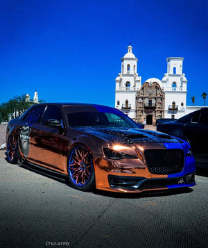 2014 Chrysler 300S with custom 22-inch forged wheels parked in front of a historic building, showcasing stylish custom rims.