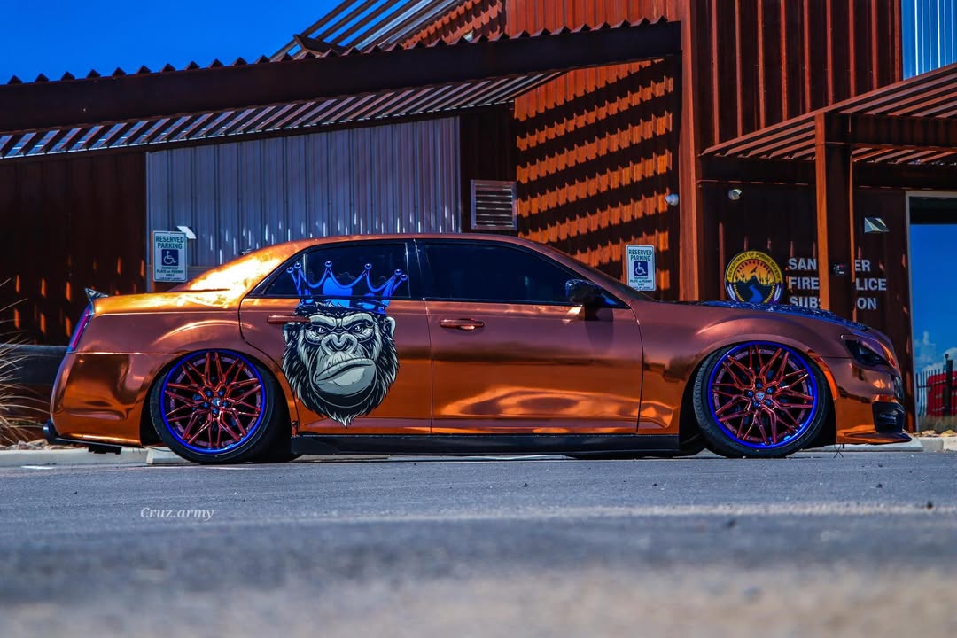 2014 Chrysler 300S with custom 22-inch forged wheels and unique gorilla graphic design.