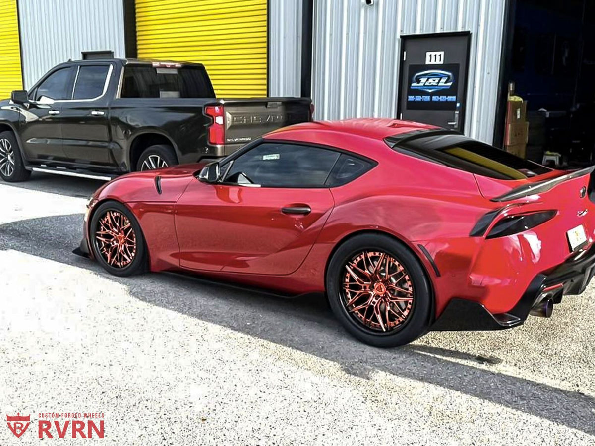 Rear view of 2021 Toyota Supra A90 with RVRN C081 20x11 rose gold & black forged wheels.
