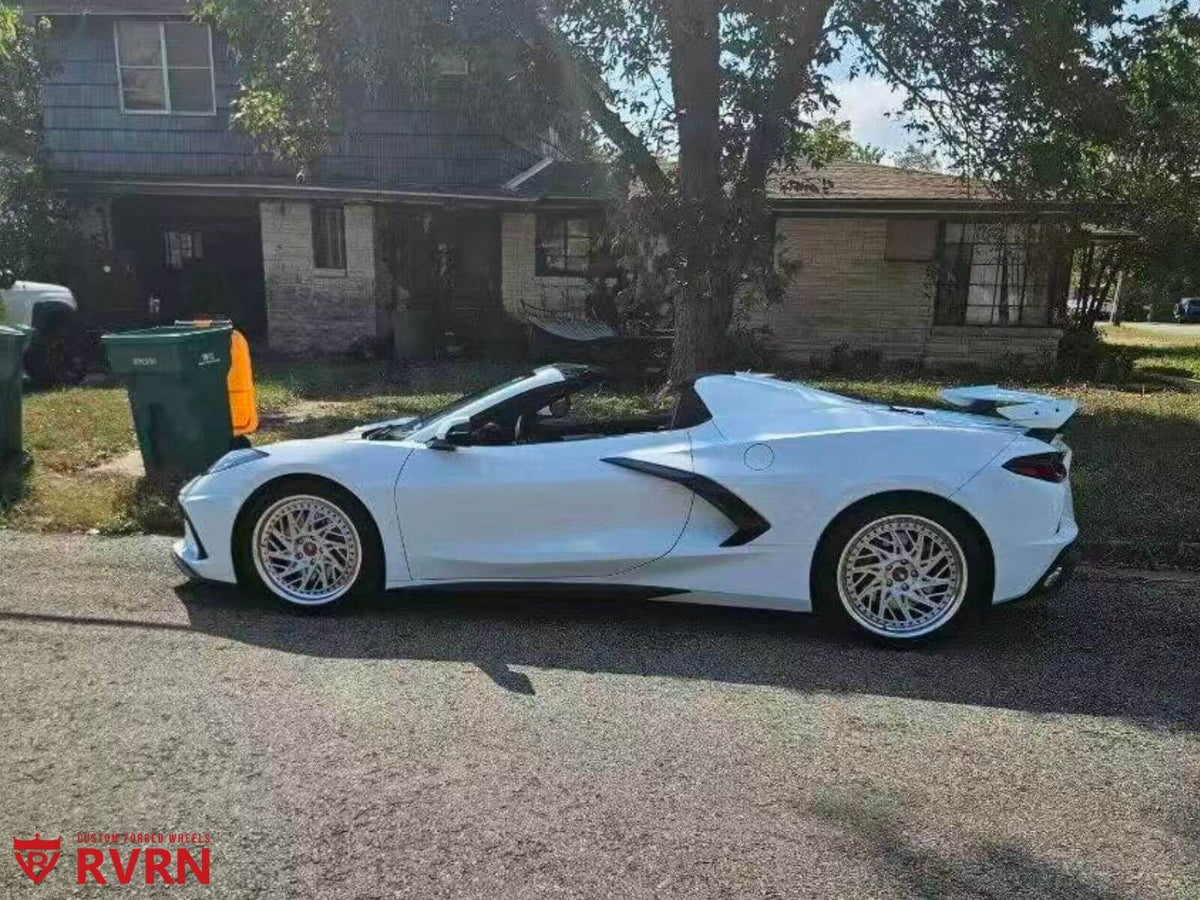 2021 Corvette C8 Z51 with custom forged wheels, showcasing its sleek design and aftermarket rims on a sunny street.