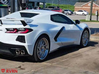 2021 Corvette C8 Z51 with custom forged wheels parked at a gas station, showcasing aftermarket rims.