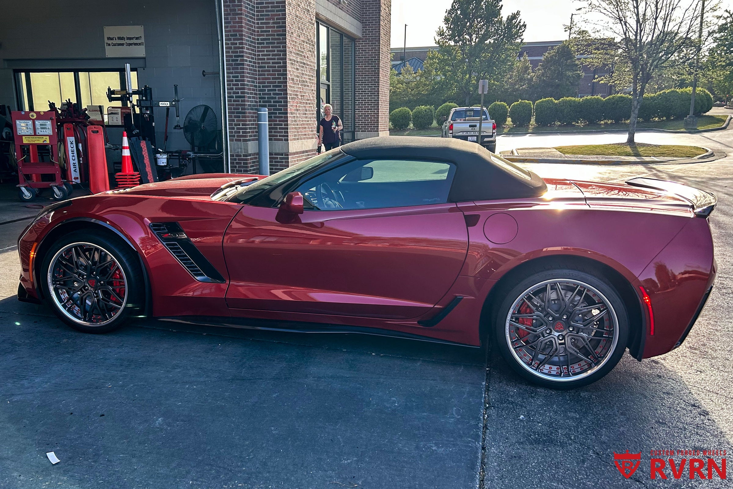 Roderick Harrisons 2015 Corvette C7 Z06 in Long Beach Red with RV-T081 custom forged wheels parked at automotive service center