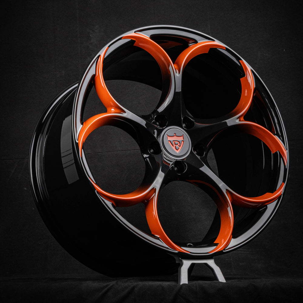 Corvette C8 RV-MS016 black and orange custom forged wheel by RVRN Wheels on display.