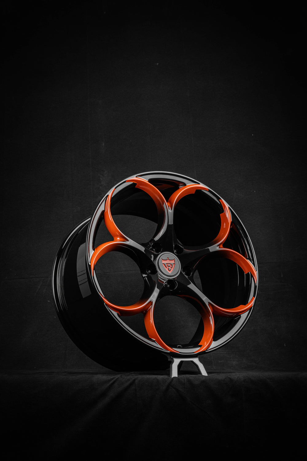 Corvette C8 custom black and orange forged wheel RV-MS016 by RVRN Wheels against a dark background