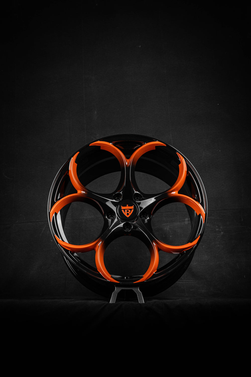 Black and orange custom forged Corvette C8 wheels by RVRN Wheels (RV-MS016) on a dark background.