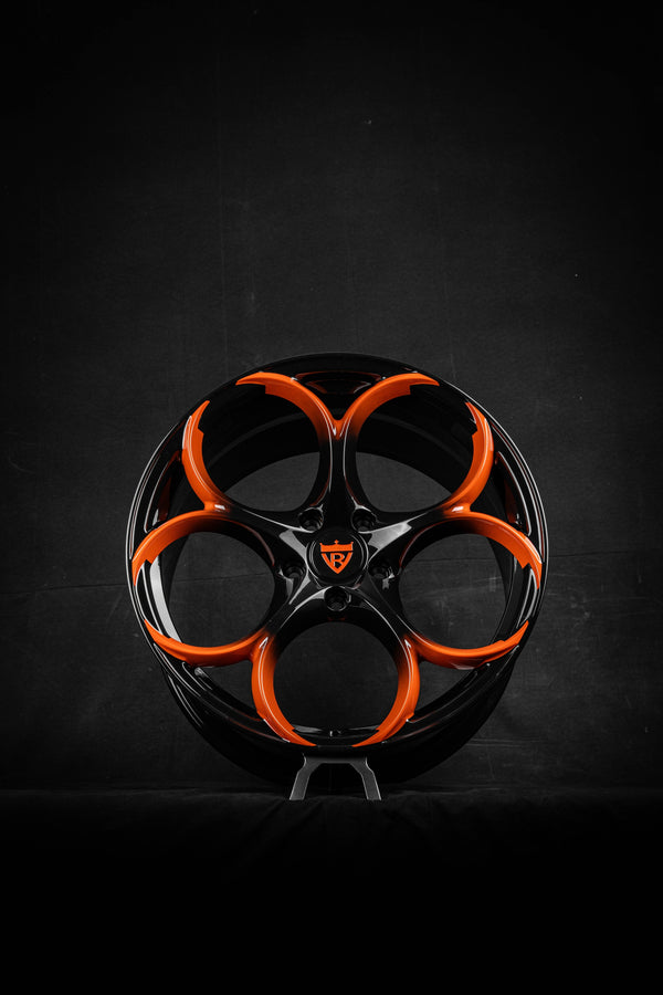 Black and orange custom forged Corvette C8 wheels by RVRN Wheels (RV-MS016) on a dark background.
