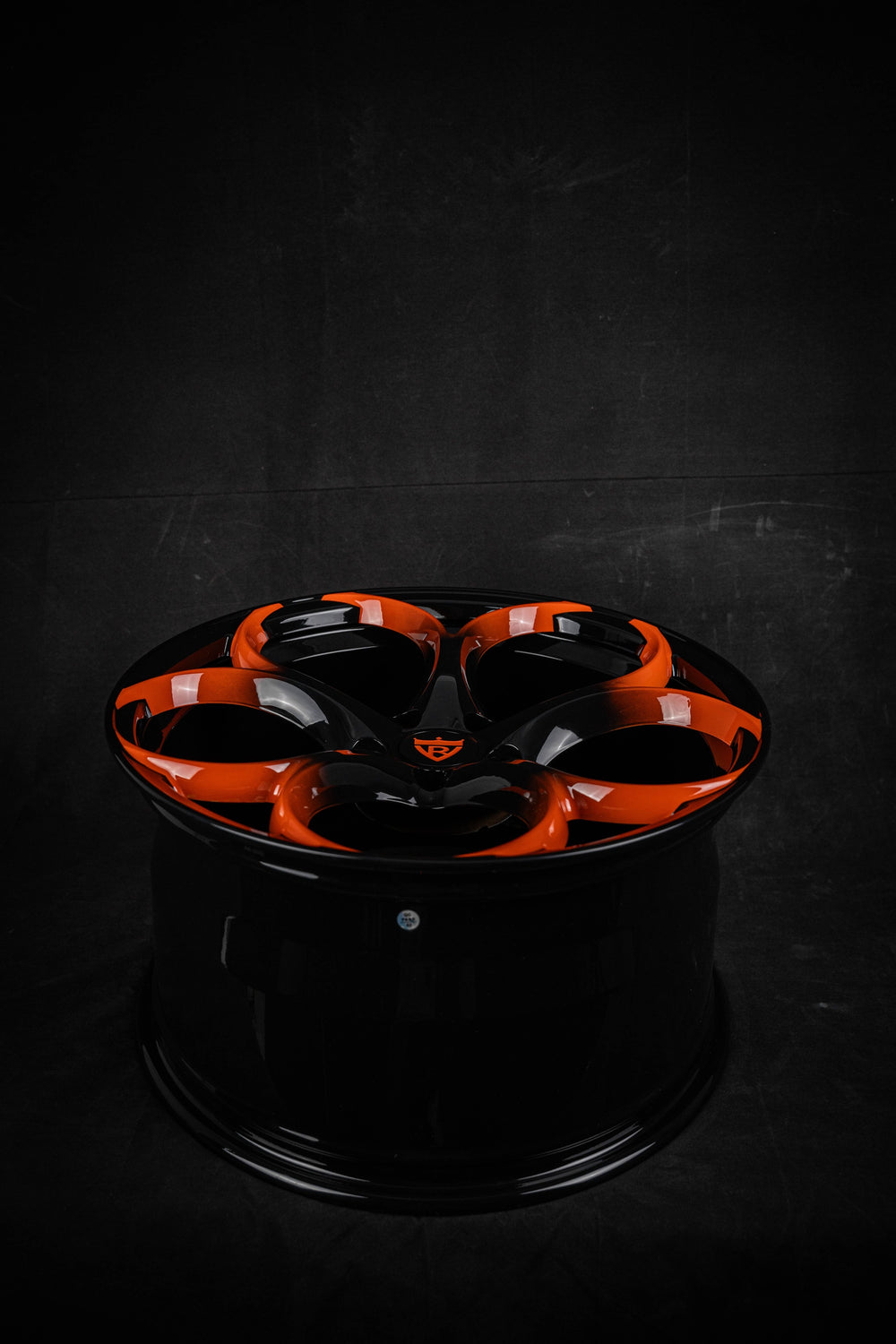 Black and orange custom forged Corvette C8 RV-MS016 wheels by RVRN Wheels on a dark background