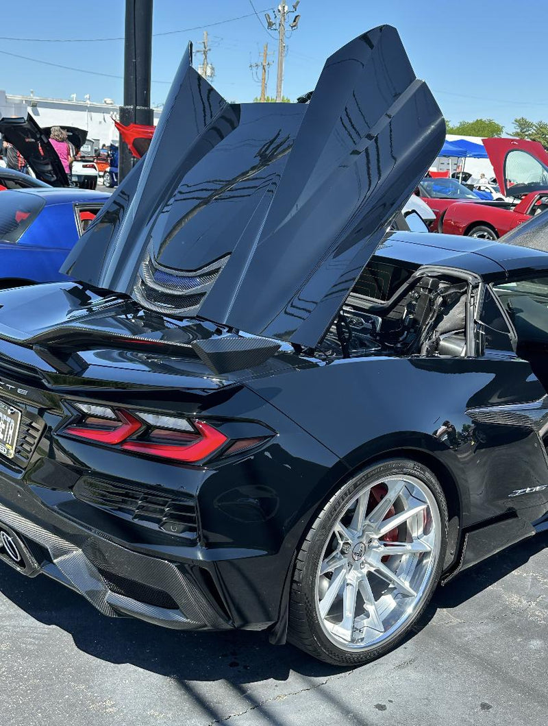 Father's Day automotive gathering featuring enthusiast vehicles.