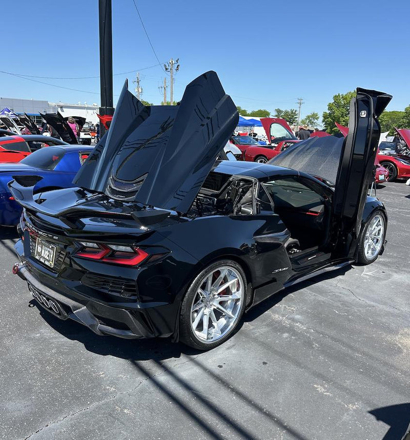Corvette Z06 parked among featured vehicles at the event.
