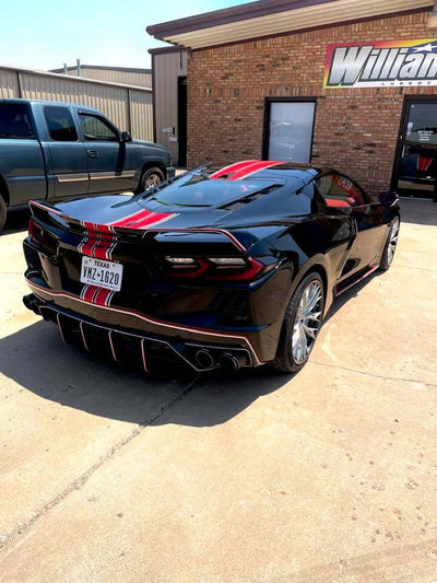 Close-up of 2024 Corvette C8 Z51 rear RVRN RV-DC04 wheel, highlighting brushed aluminum spokes, carbon flash metallic barrel, and RVRN red screws