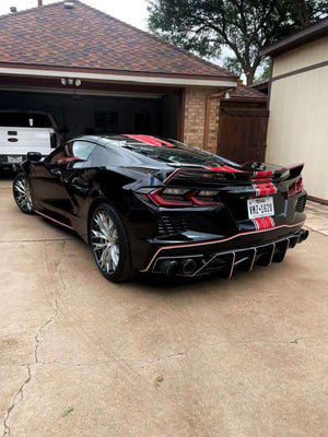 Close-up of 2024 Corvette C8 Z51 rear RVRN RV-DC04 wheel, highlighting brushed aluminum spokes, carbon flash metallic barrel, and RVRN red screws