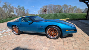 1995 Corvette C4 ZR1 with custom forged wheels and deep lip rims, showcasing stunning design and vibrant color.