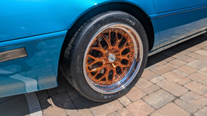 Custom forged RVRN wheels on a Corvette C4, showcasing a stylish orange finish and sleek design.