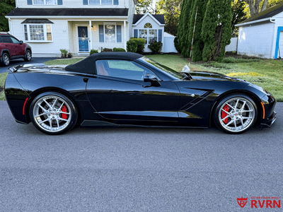 Close-up of 21x13 RVRN forged 6-spoke brushed aluminum wheel on 2026 Corvette C8 Z06, rear wheel