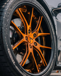 Close-up of super concave bronze rims on a 2025 Corvette C8 Z06 featuring RVRN forged wheels.