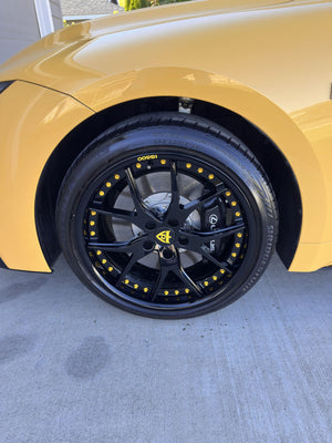 Detailed view of the RVRN RV-DC24 wheel and gold yellow screws behind a Lexus brake caliper on a 2025 Lexus IS500