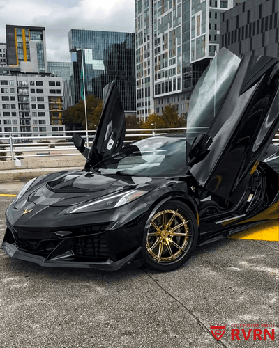 Black 2025 Corvette C8 E-Ray on RVRN gold carbon fiber wheels 20x10 front 21x13 rear flush fitment