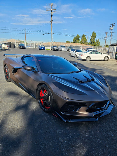 Close-up detail of red and black forged wheel spokes on Corvette C8 Z51, precision machining and custom wheel design