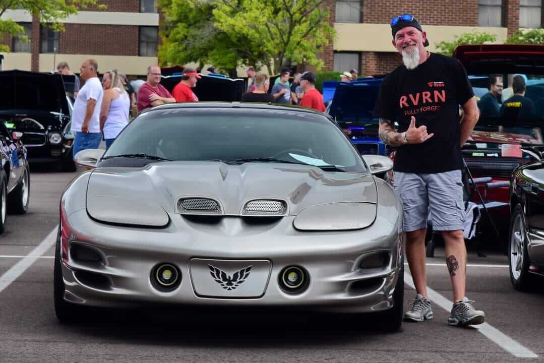Front view of a silver 2002 Pontiac Trans Am on RVRN RV-DC56 deep dish custom forged wheels at a car show with a crowd