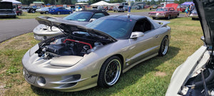 Front three-quarter view of a silver 2002 Pontiac Trans Am on RVRN RV-DC56 deep dish custom forged wheels at an outdoor car show