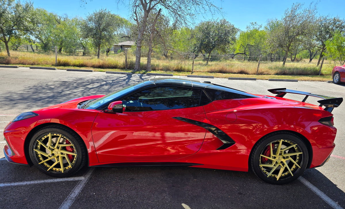 Side profile of a red 2020 Corvette C8 Z51 on RVRN RV-DF041 custom forged wheels with gold spokes and gloss black barrels