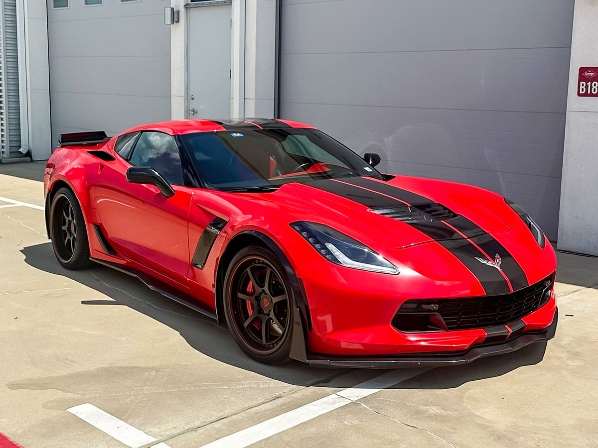 2019 Corvette C7 Z06 with RVRN Forged deep dish black rims and red accents, showcasing C7 forged wheels in a striking outdoor setting.