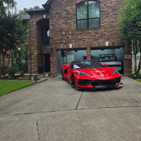 Red Corvette C8 with matte bronze RVRN forged wheels parked in driveway, showcasing custom 5 spoke design and carbon flash rims.