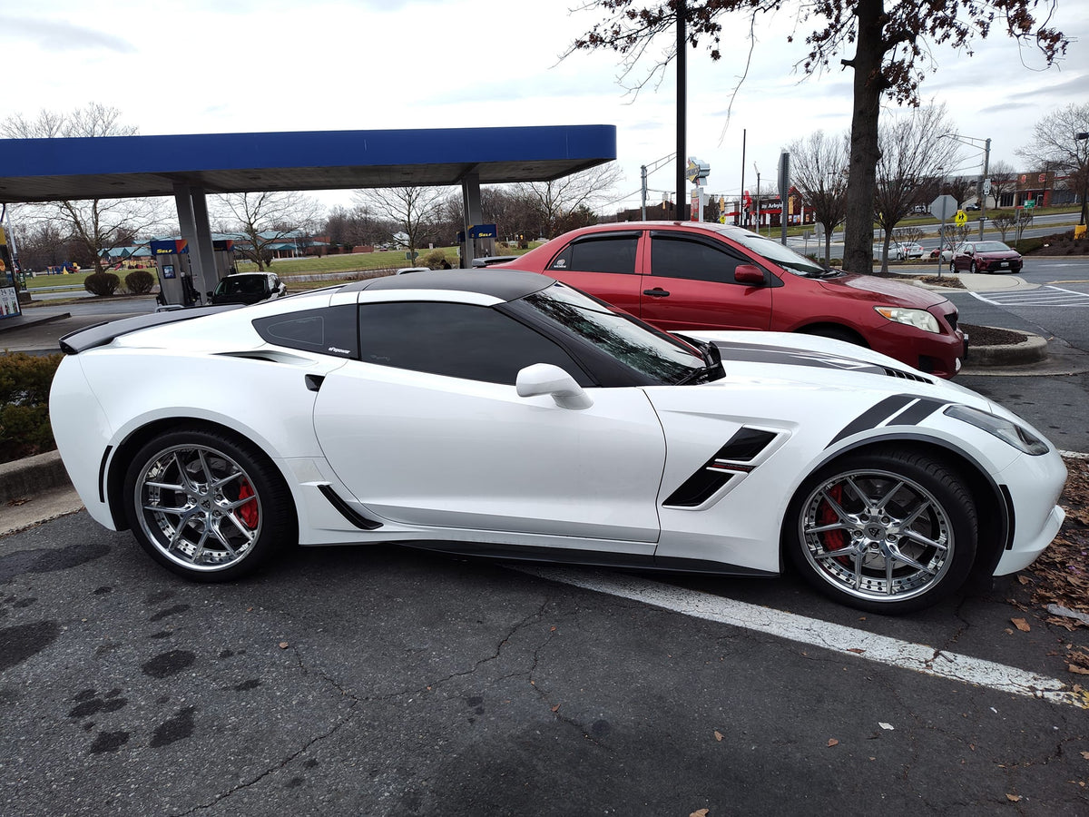 2017 C7 Corvette Grand Sport with custom forged RVRN wheels parked at gas station.