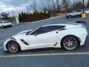 White C7 Corvette Grand Sport with aftermarket wheels, showcasing performance and style, ideal for 2017 Corvette enthusiasts.
