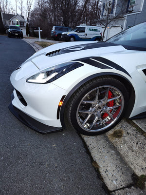 C7 Corvette Grand Sport featuring aftermarket wheels, showcasing a sleek design and performance enhancements.