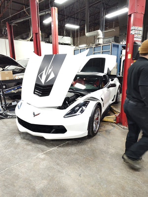 2017 C7 Corvette Grand Sport with custom forged RVRN wheels showcased in a garage setting.
