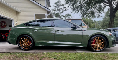 Front view of 2023 Audi S5 fitted with RVRN DR08 20x9 custom wheels copper black