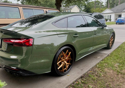 Side profile of Audi S5 showcasing RVRN DR08 20x9 custom forged wheels in copper black