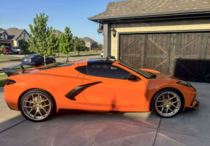 Side profile of an orange 2024 Corvette C8 Stingray on RVRN RV-DR08 deep dish polished frozen gold and chrome forged wheels