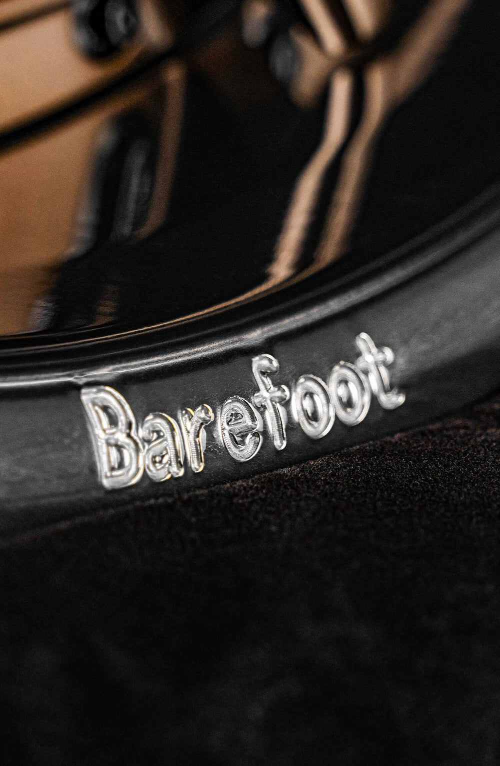 Close-up of Barefoot inscribed on a stylish deep dish rim designed for 1972 Chevy C10 custom wheels.
