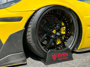 Detailed view of the rear RVRN RV-DR08D gloss black custom forged wheel with carbon fiber lip and yellow screws on a yellow Corvette
