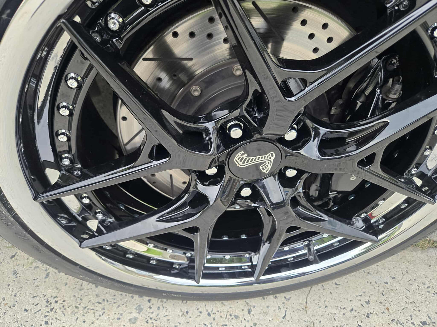 Custom forged black and chrome rims on a 2011 Ford Shelby GT500, showcasing RVRN RV-DR08D series wheels.